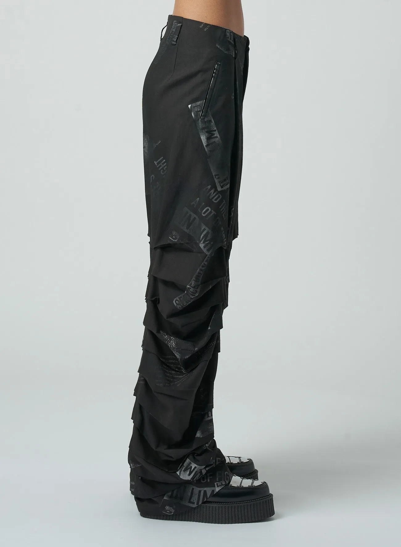 NEWSPAPER PRINT PANTS WITH HORIZONTAL PLEATS